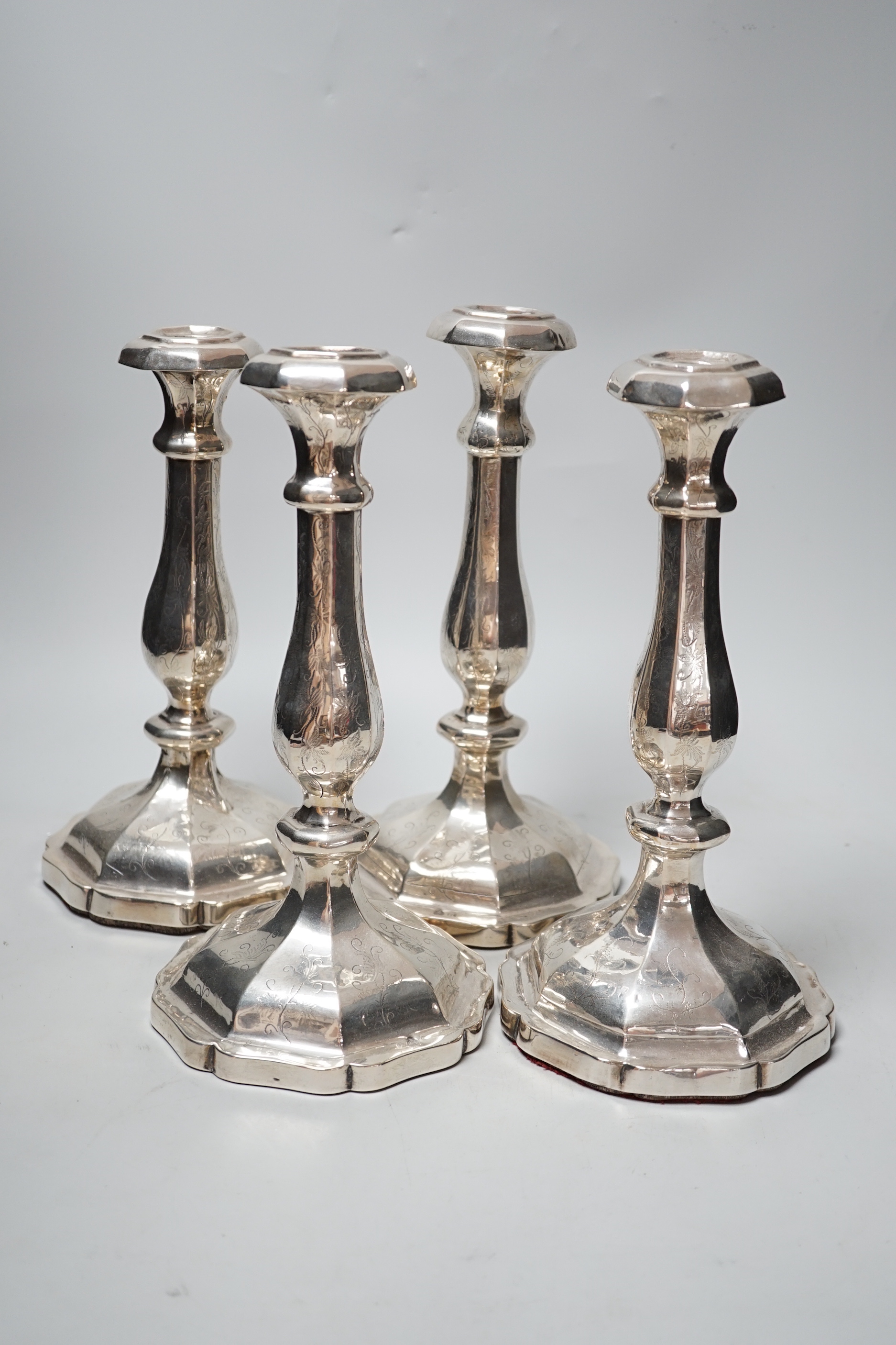 A set of four 19th century Austro-Hungarian white metal candlesticks, dated 1863, height 27.4cm, et infra (a.f.), weighted.